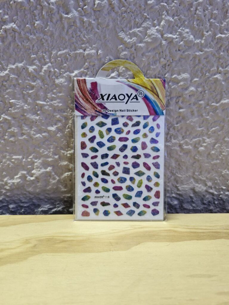 Fotografía de Adhesivos para uñas modelo Gemas y Minerales 1 Precio: $10 MXN por cada hoja Material: Plástico Formato: Plantilla con 40 estampas aproximadamente Dimensiones de paquete: Ancho 8.3 cm., Alto 13 cm. Categoría: Nuevo